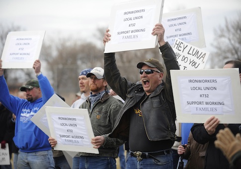 Lonzo West, President of Local Union 732 Ironworkers, yells in support of unions during The Rally to Defend the American Dream