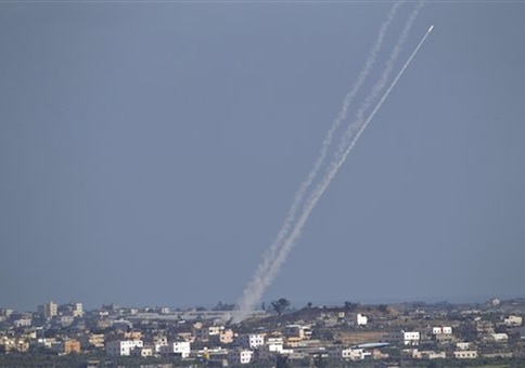 A rocket fired by Palestinian militants from inside Gaza Strip makes its way towards Israel