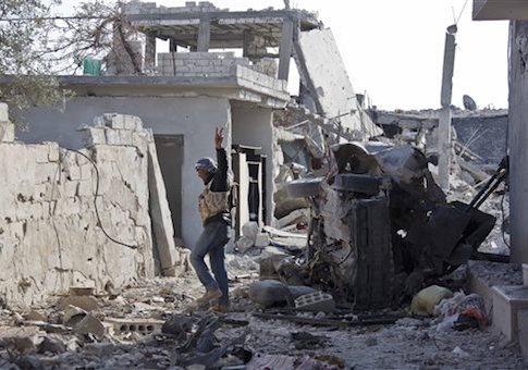 a Free Syrian Army fighter from Shams al-Shamal heads to the front line in Kobani, Syria