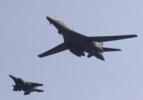 U.S. B-1B Lancer bomber fly over Osan Air Base with South Korean Air forces F-15K Fighting Falcon in Pyeongtaek, South Korea, Tuesday, Sept. 13, 2016