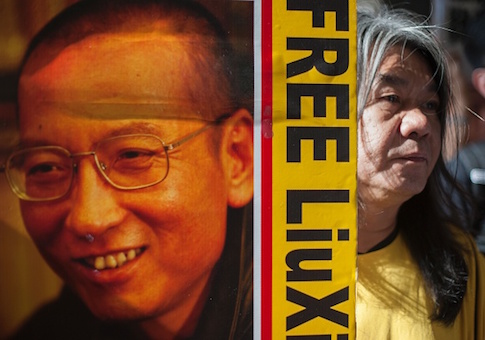 Hong Kong activist and legislator Leung Kwok-hung holds a placard calling for the release of Chinese human rights activist Liu Xiaobo