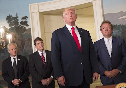 U.S. President Donald Trump listens to a reporter's question after signing a memorandum on addressing China's laws, policies, practices, and actions