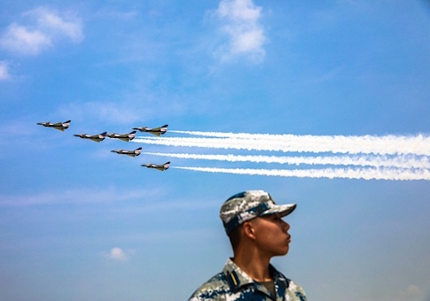 This photo shows China's Bayi Aerobatic Team performing in the sky during the Chinese People's Liberation Army Air Force Aviation Open Day