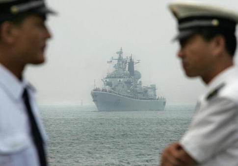 The USS Curtis Wilbur is seen in the background