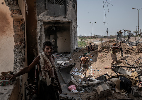 Yemeni fighters man a frontline position in an area which contains the main supply route linking Hodeidah city to the rebel-held capital Sanaa