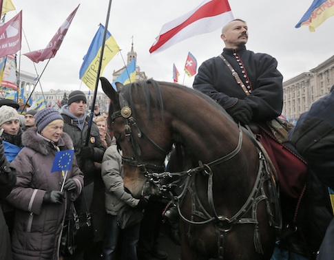 A man dressed as a Cossack on a horse pauses during the Ukrainian protests