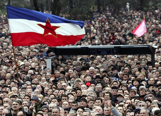 Supporters of Slobodan Milošević wave an old Yugoslav flag in Belgrade. (AP)