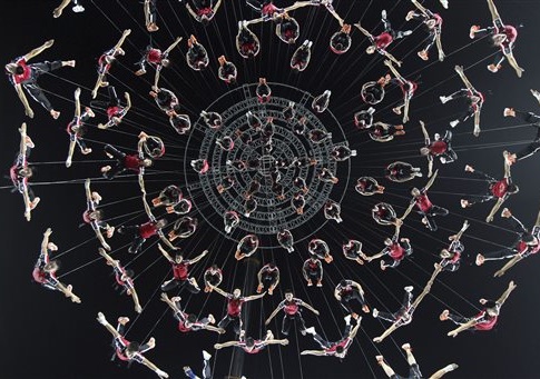 Performers tied to wires rehearse for the opening ceremony of the 2014 Nanjing Youth Olympic Games