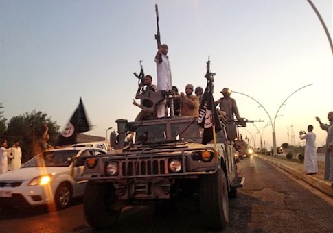 ISIL fighters in a parade in Mosul