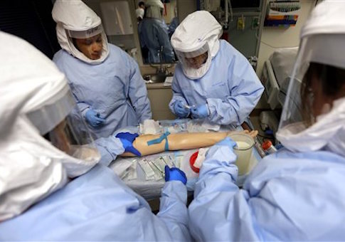 Members of the Department of Defense's Ebola Military Medical Support Team go through special training