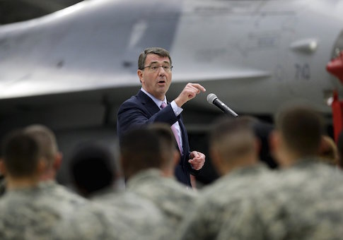 U.S. Defense Secretary Ash Carter addresses U.S. military personnel during a meeting near an F-16 fighter jet at Osan U.S. Air Base in Pyeongtaek