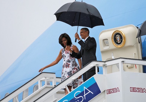 U.S. President Barack Obama and his wife Michelle exit Air Force One at Havana's airport