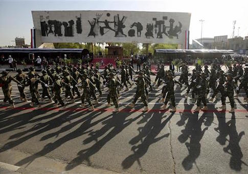 Iraqi government-backed Popular Mobilization forces take part in a joint military parade with Iraqi security forces in Baghdad