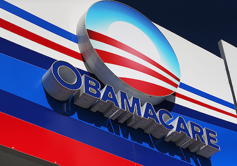 An Obamacare sign is seen on the UniVista Insurance company office