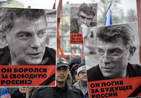 Russia's opposition supporters carry portraits of Kremlin critic Boris Nemtsov during a march in central Moscow on March 1, 2015