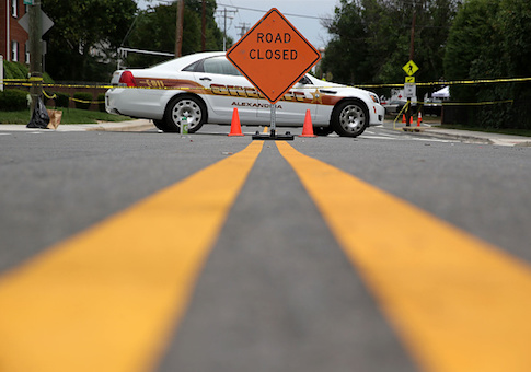 An Alexandria Sheriff vehicle is seen at an intersection near the the site where a gunman opened fire at the Eugene Simpson Stadium Park June 15