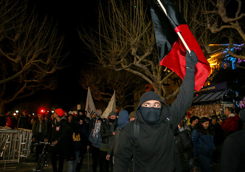 Protesters march off the UC Berkeley campus on February 1 in Berkeley, California