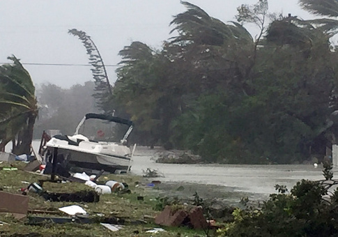 Debris is shown strewn along a roadway in the wake of powerful Hurricane Irma on September 11, 2017 in Isamorada, a village encompassing six of the Florida Keys / Getty Images