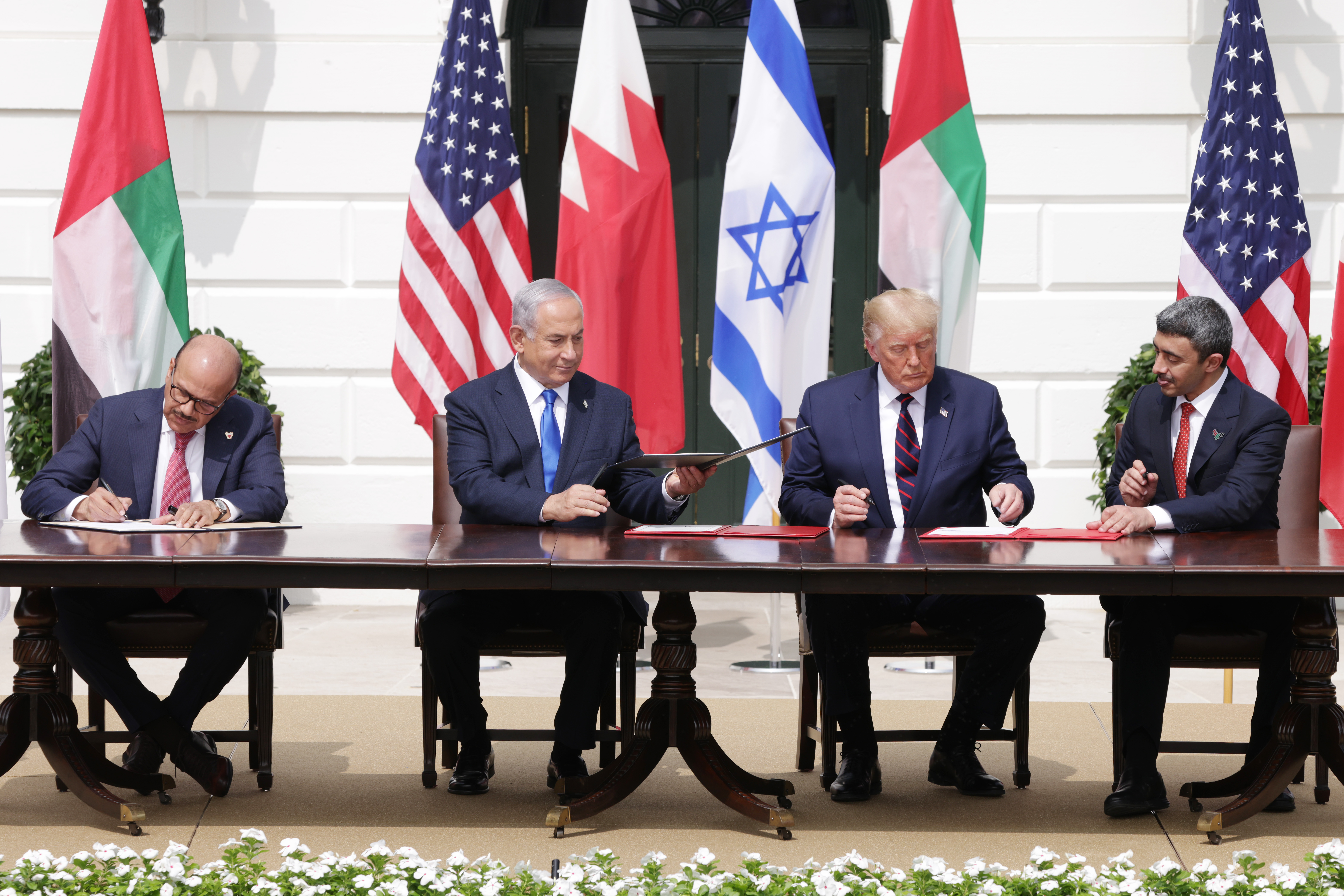 Foreign Affairs Minister of Bahrain Abdullatif bin Rashid Al Zayani, Prime Minister of Israel Benjamin Netanyahu, U.S. President Donald Trump, and Foreign Affairs Minister of the United Arab Emirates Abdullah bin Zayed bin Sultan Al Nahyan participate in the signing ceremony of the Abraham Accords
