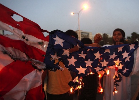 Libyan protesters burn American flag