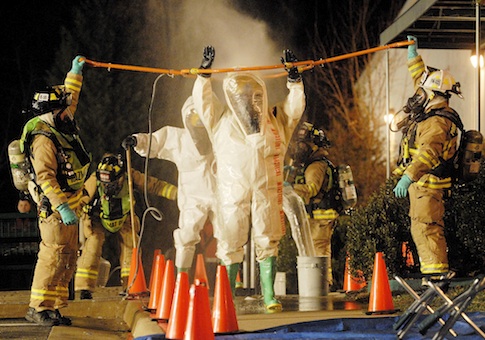 Firefighters with the Commonwealth of Virginia Regional HazMat Team wearing Level A Haz Mat suits