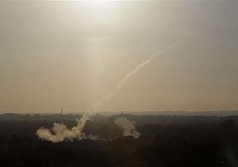 A rocket is fired from Gaza City towards Israel, Saturday, Aug. 9