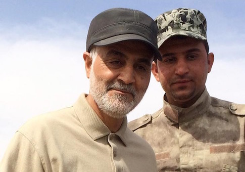 Iranian Revolutionary Guard Commander Soleimani stands at the frontline during offensive operations against Islamic State militants in the town of Tal Ksaiba in Salahuddin province