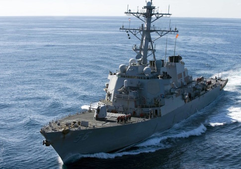The guided-missile destroyer USS John S. McCain approaches the aircraft carrier USS George Washington for a fueling at sea in this December 5, 2010