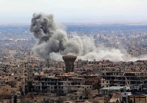 Smoke rises from the rebel-held enclave of Eastern Ghouta on the outskirts of the Syrian capital following fresh air strikes and rocket fire