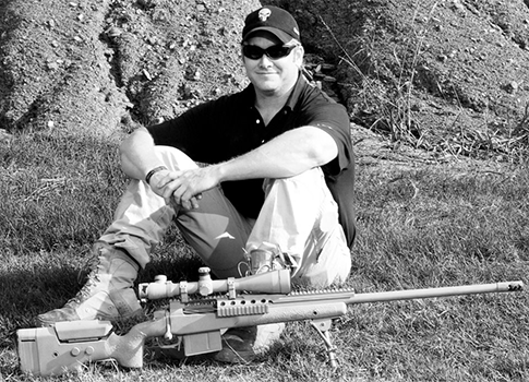Kyle with his Lapua .338, the gun used to make his longest kill / Facebook