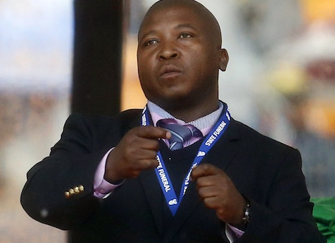 Man passing himself off as a sign language interpreter punches the air during a speech being given by India's President Mukherjee at memorial service for late South African President Mandela in Johannesburg