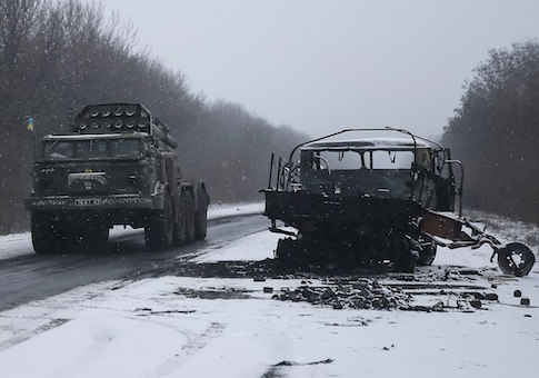 Ukrainian armed forces ride on a multiple rocket launcher system near Debaltseve, eastern Ukraine February 16, 2015
