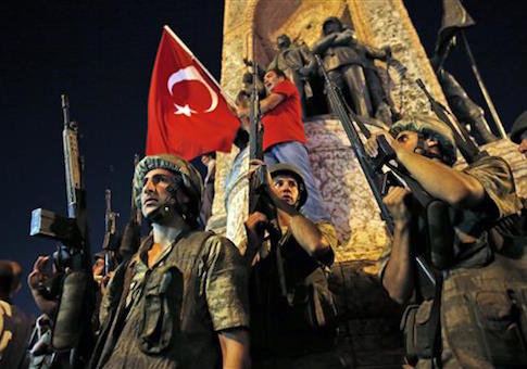 Turkish soldiers secure the area as supporters of Turkey's President Recep Tayyip Erdogan protest in Istanbul's Taksim square