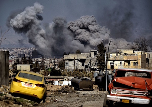 Smoke plumes rise after an airstrike in west Mosul