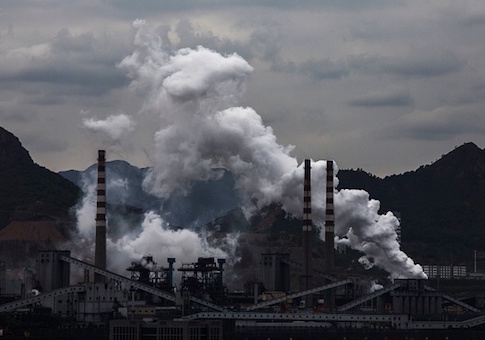 Smoke and steam billow from a Chinese state owned steel plant on June 2, 2017 in Hebei