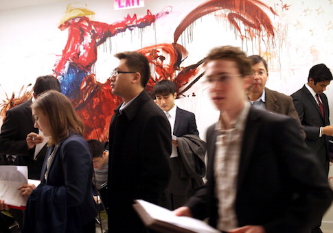 Job seekers attend a job fair