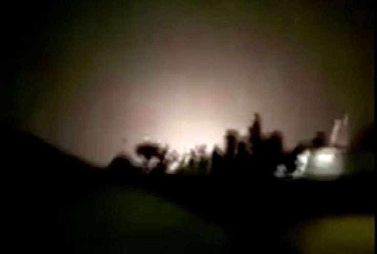 An explosion is seen following missiles landing at what is believed to be Ain al-Asad Air Base in Iraq