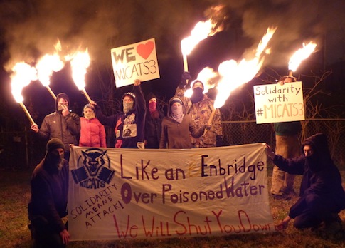 Torch-Carrying Environmentalists Protest at Oil Exec’s Home