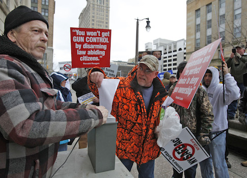 Protesters Shred SAFE Act Registration Cards