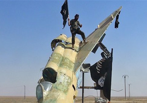 ISIS Crucifies Young Men on Electrical Poles