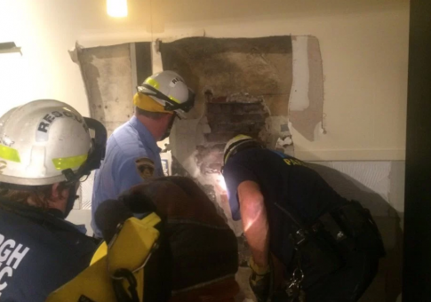 Man Gets Stuck Between Two Buildings After Trying to Show Off for Date