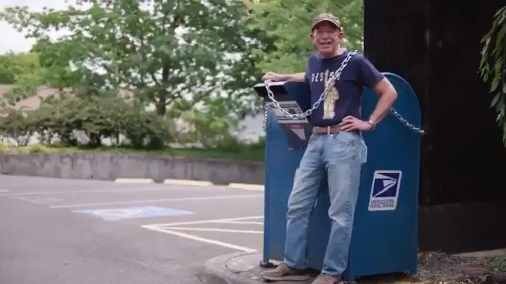 Oregon Dem Chains Himself to Mailbox to #Resist USPS Changes