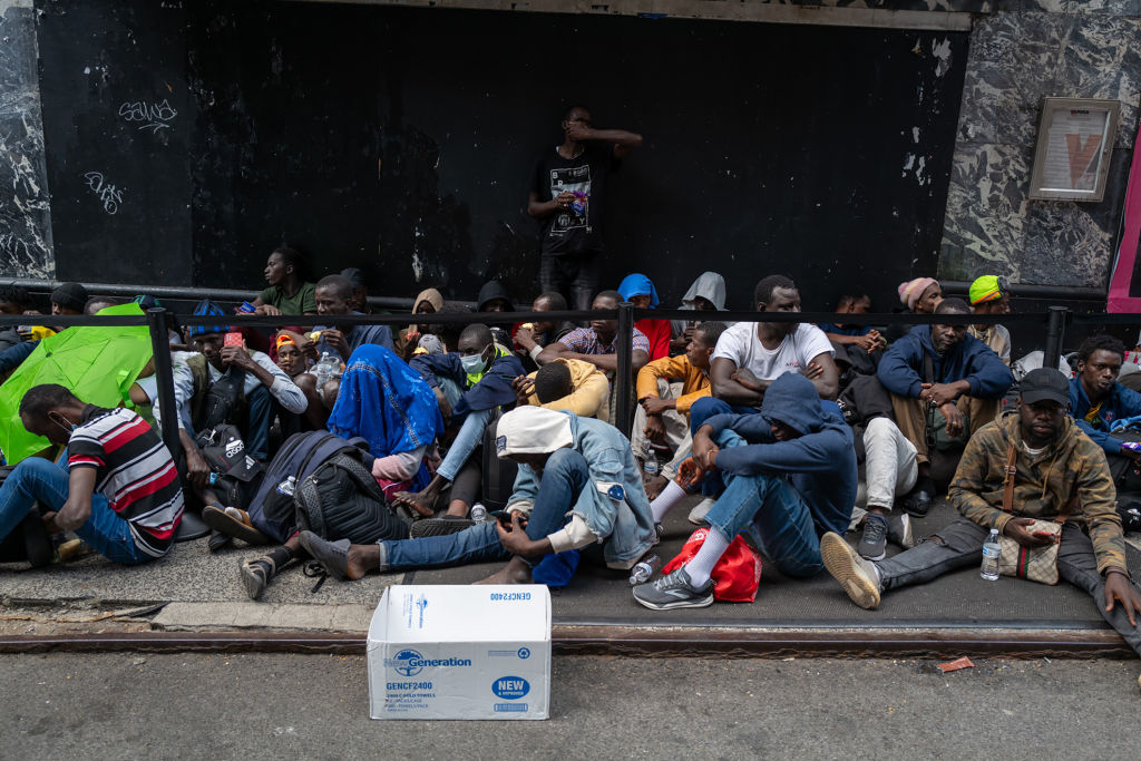 Dozens of Migrants Sleep on Sidewalk Outside Packed NYC Hotel-Turned-Shelter