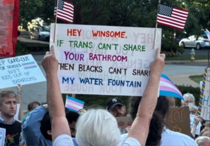 Abigail Spanberger Supporter Wields Racist Sign: 'If Trans Can't Share Your Bathroom Then Blacks Can't Share My Water Fountain'